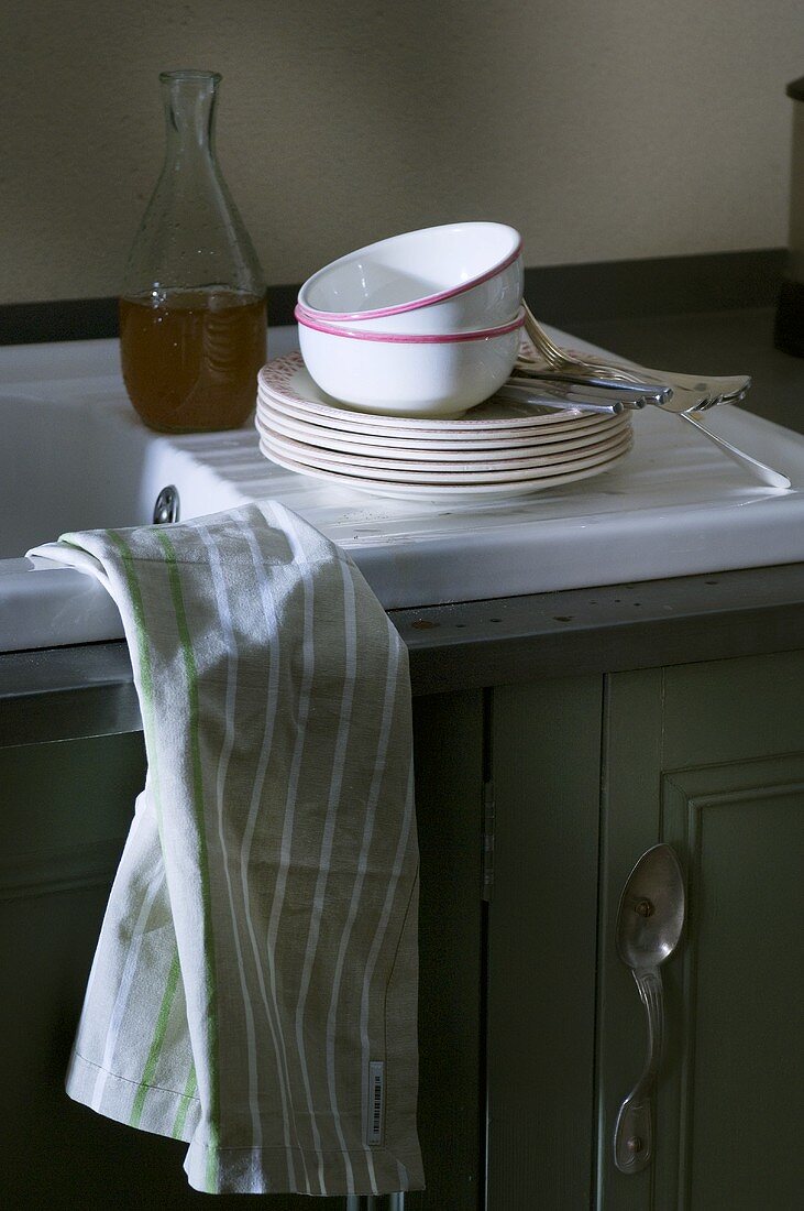 Crockery on draining board