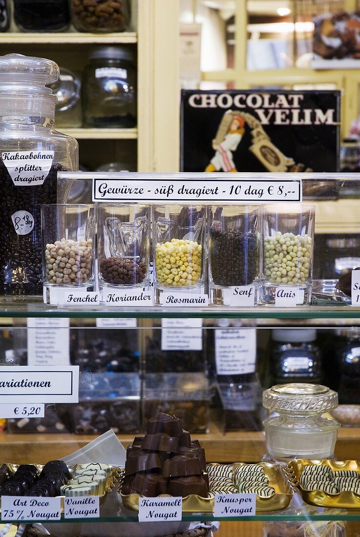 Comfits (candied spices) and chocolates in a sweet shop
