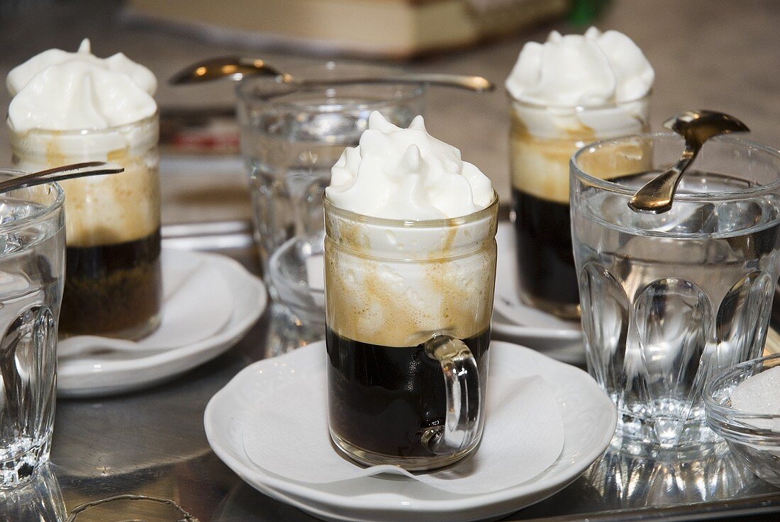 Several glasses of Einspänner (coffee with cream) on table
