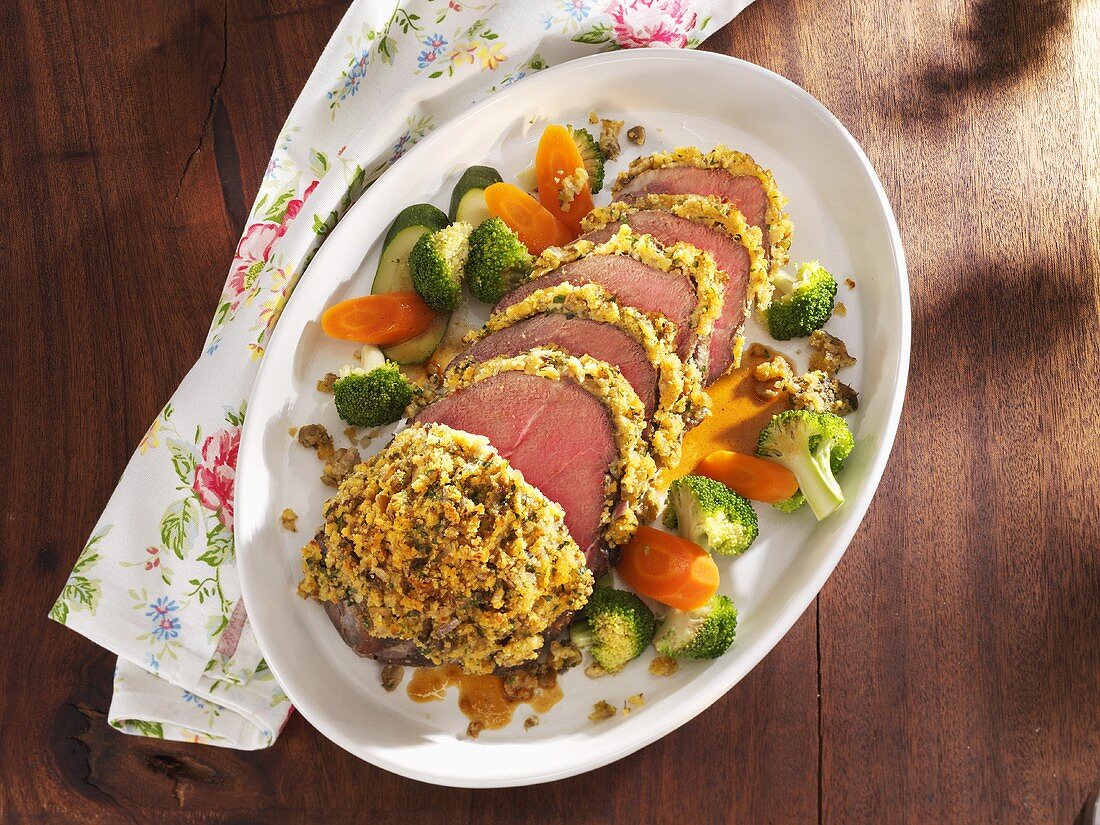 Rump steak with mushroom crust and vegetables