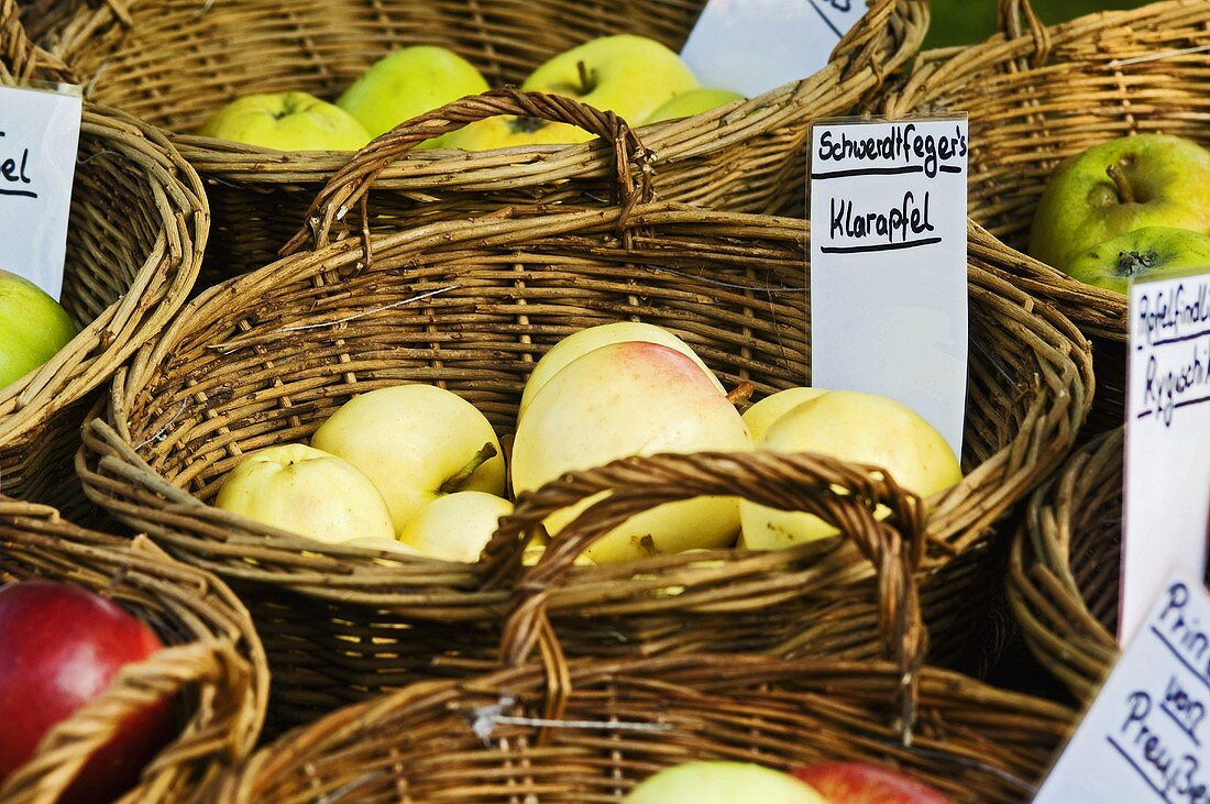 Various different apples in baskets
