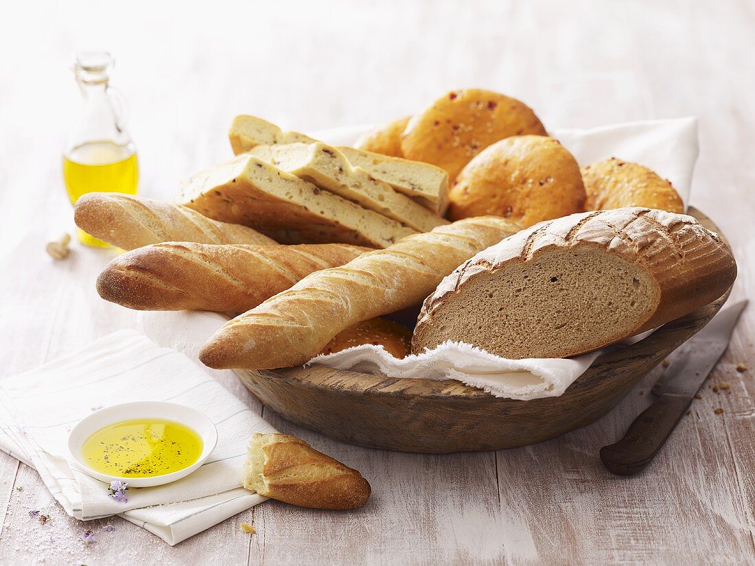 Various types of bread in a wooden dish