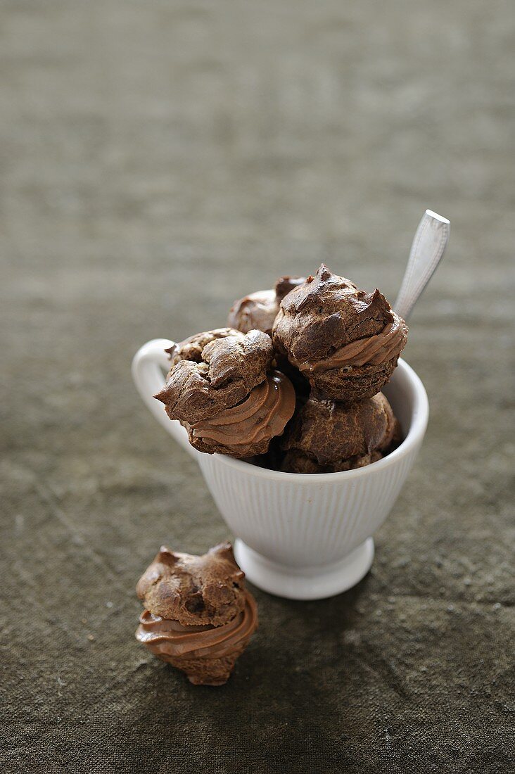 Chocolate profiteroles in cup
