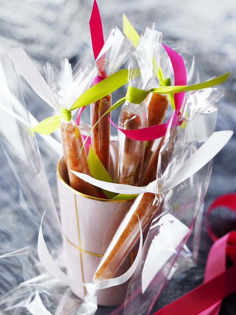Caramel sticks in cellophane wrappers
