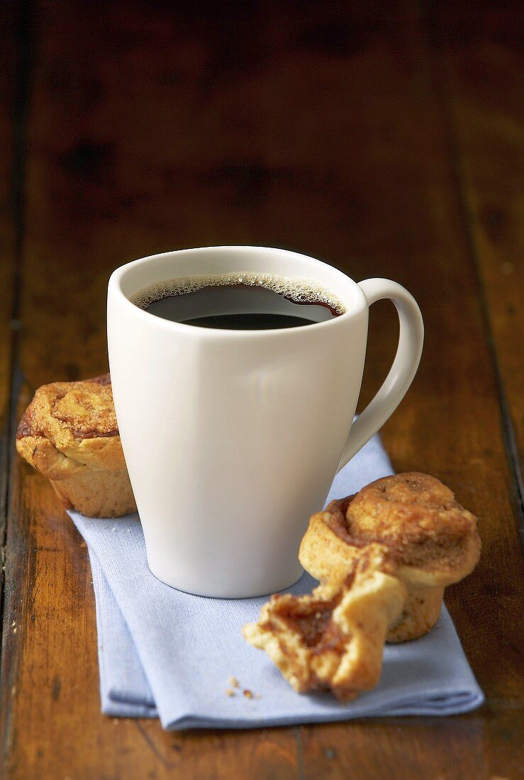 Mug of coffee and cinnamon pastries