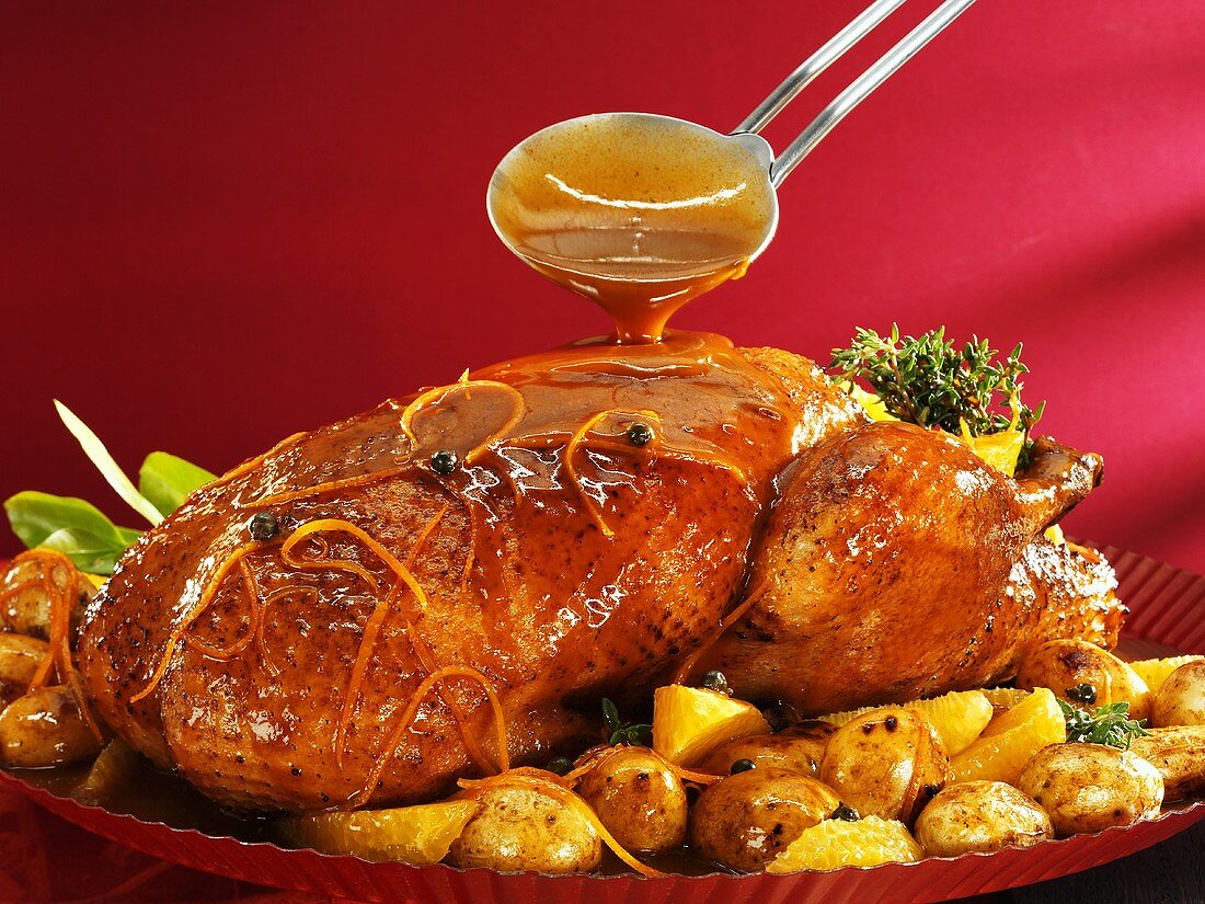 Duck with orange sauce and potatoes