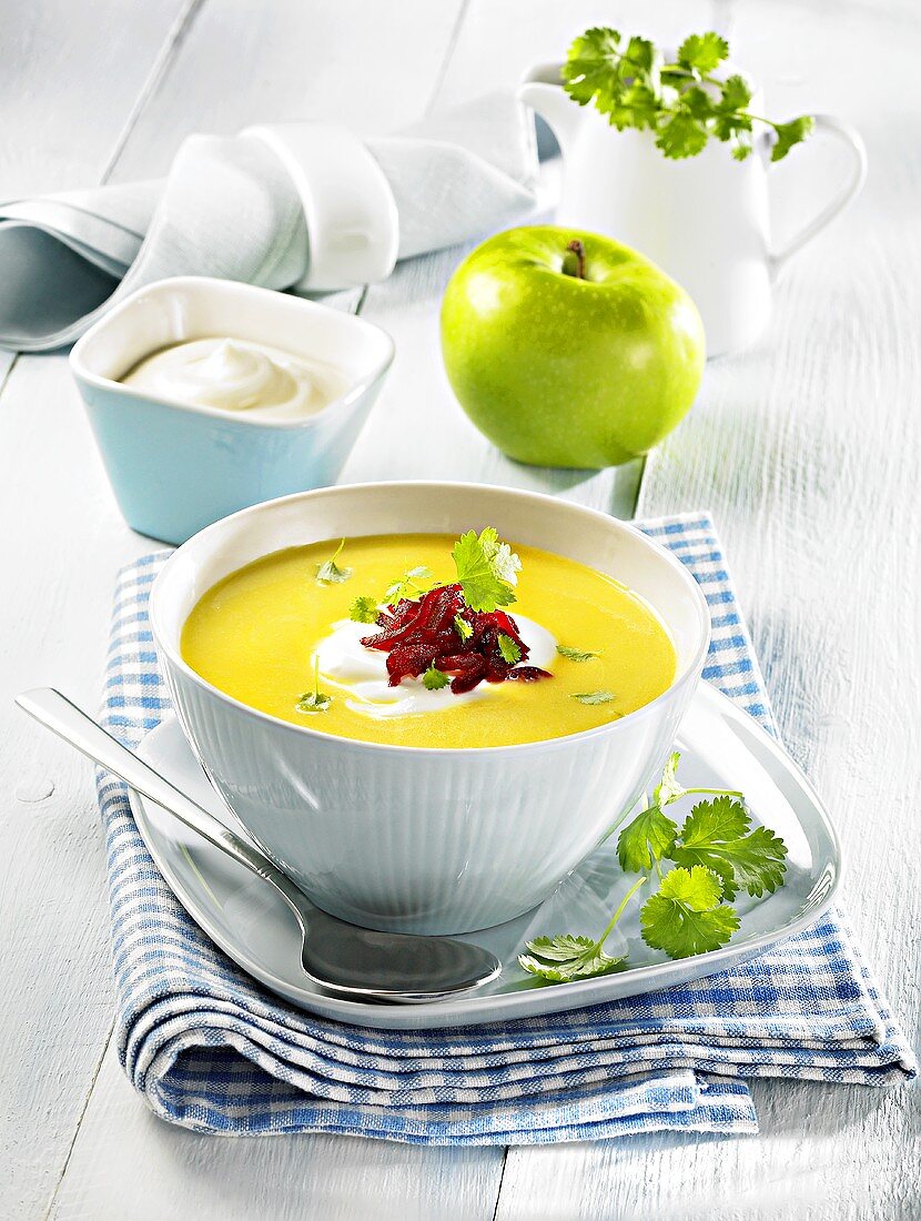 Curry soup with sour cream, apple, fresh coriander