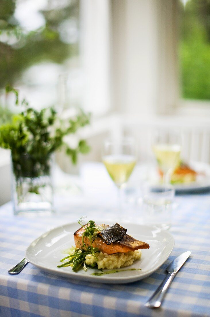 Oven-roasted salmon with lemon butter on risotto