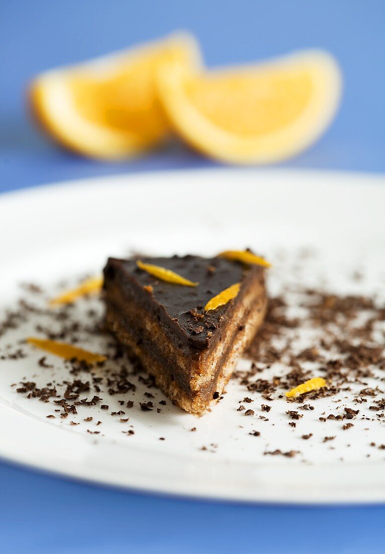 Piece of chocolate cake with orange zest