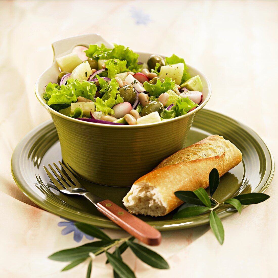 Vegetable salad with radishes, olives & pineapple, baguette