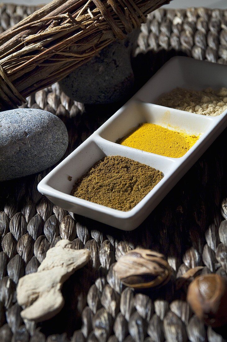 Dish of spices and other decorative items on table in spa