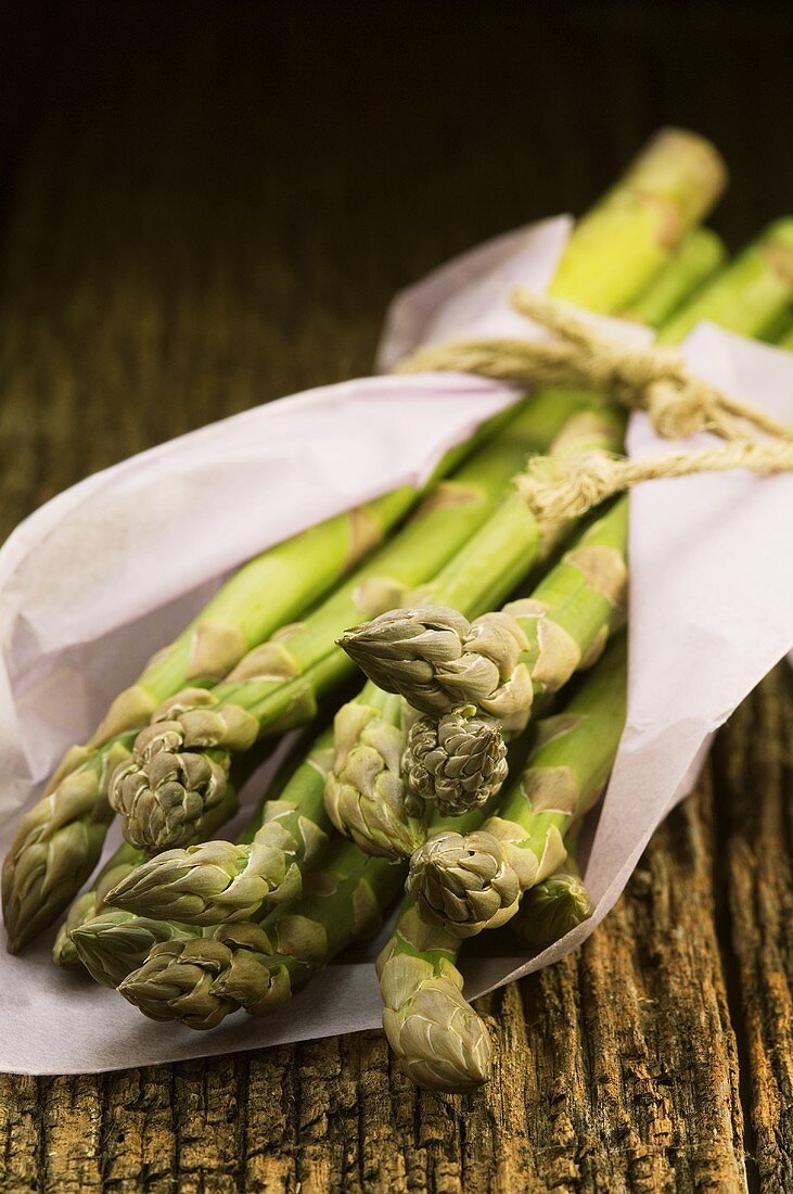 Green asparagus wrapped in paper