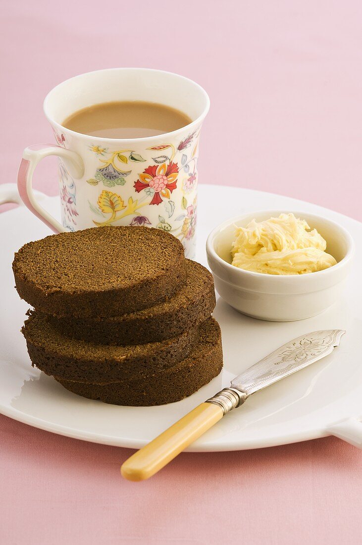 Gingerbread, butter and tea