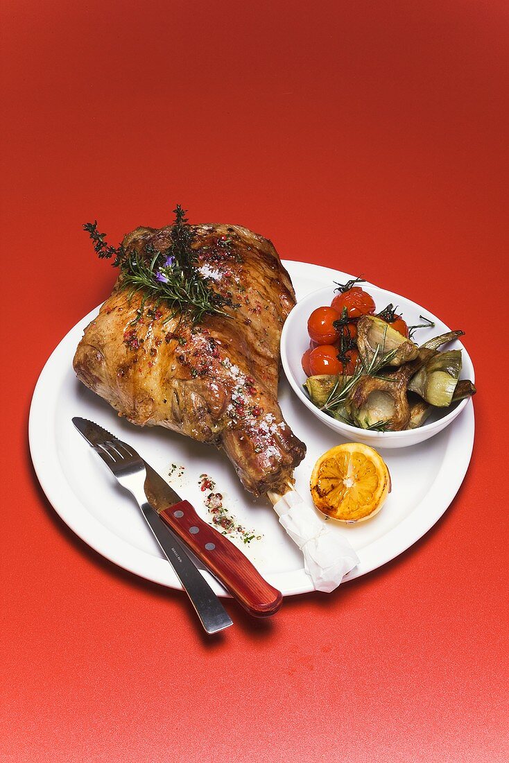 Leg of lamb with artichokes and cherry tomatoes