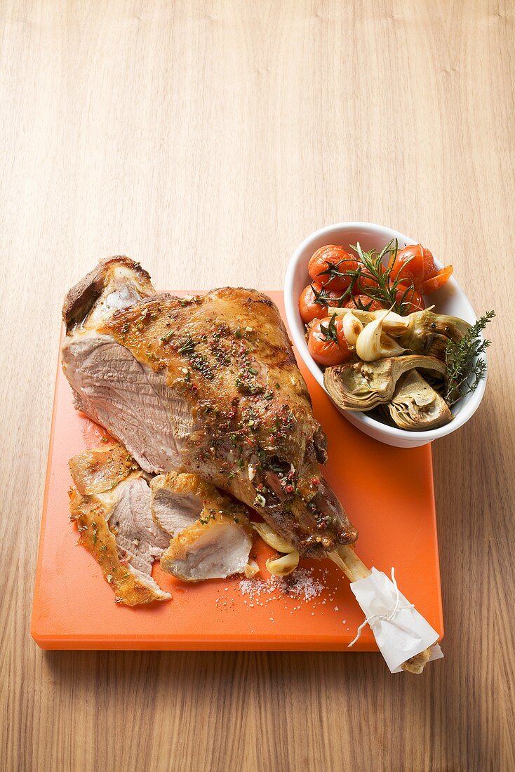Leg of lamb with artichokes and cherry tomatoes