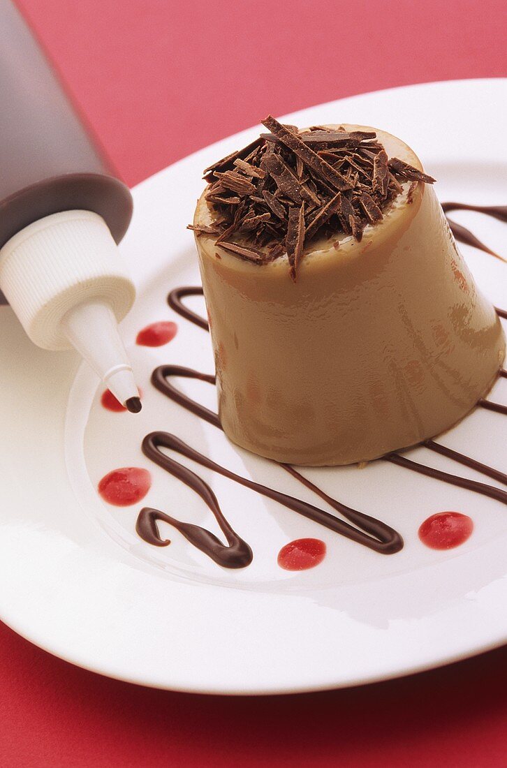 Chocolate dessert with chocolate sauce from a plastic bottle