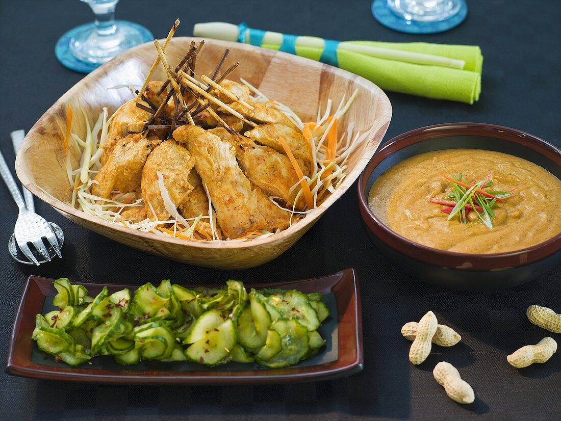 Chicken satay with peanut dip and cucumber salad
