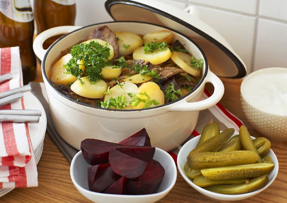 Meat and potato stew, beetroot and gherkins