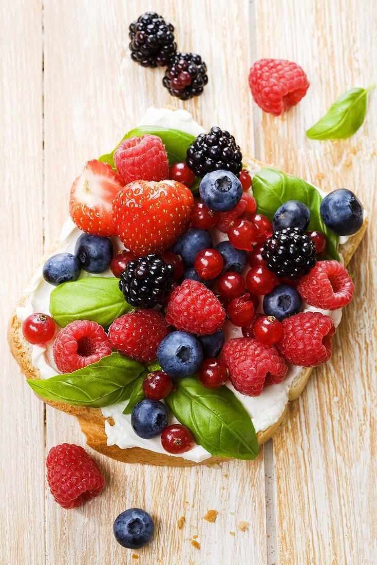 Fresh berries and basil on bread