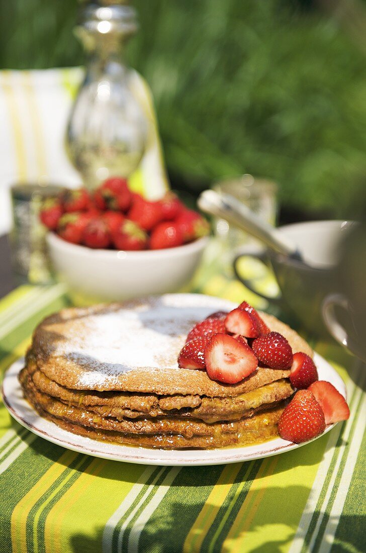 Honey and walnut cake with fresh strawberries