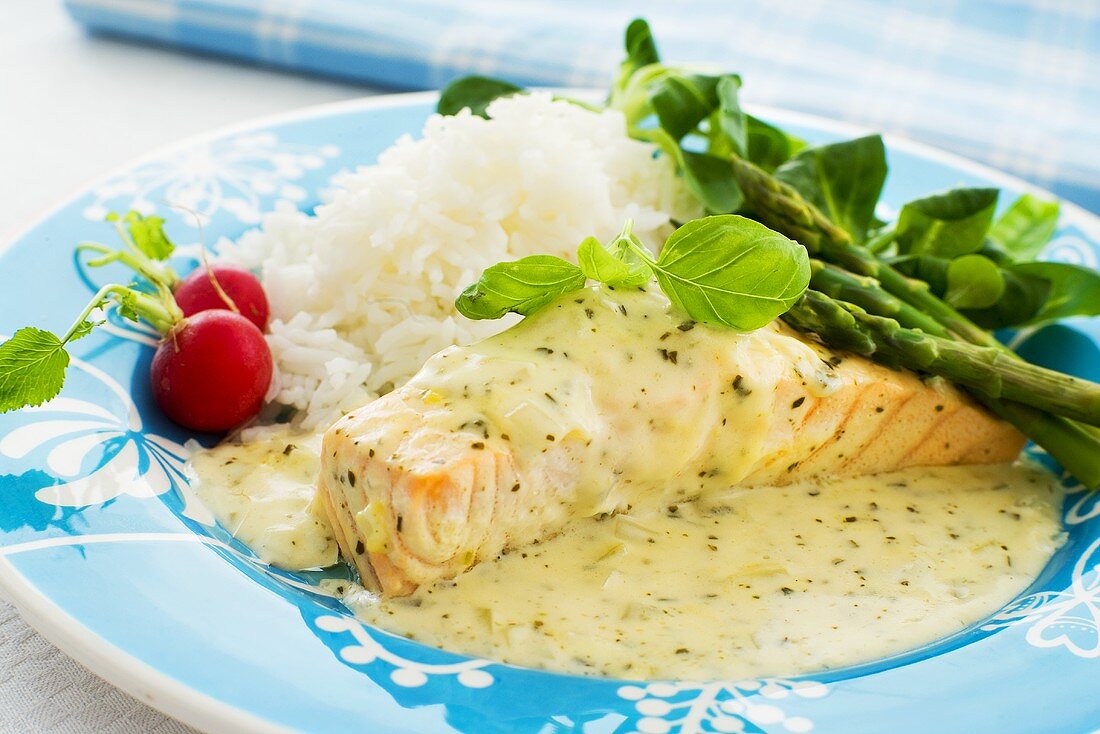 Salmon with herb sauce and green asparagus