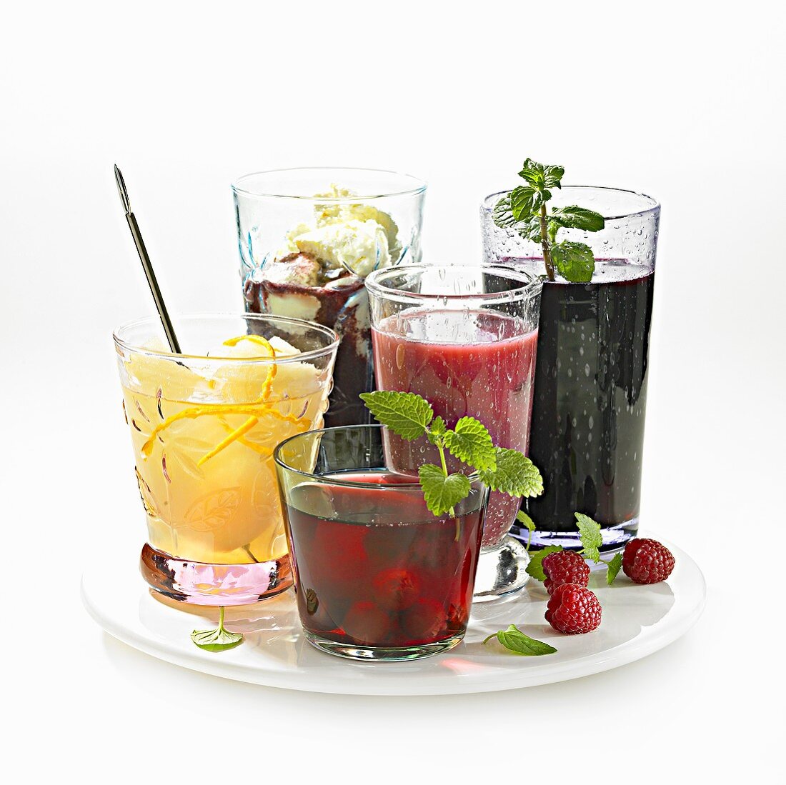 Five different types of compote in glasses