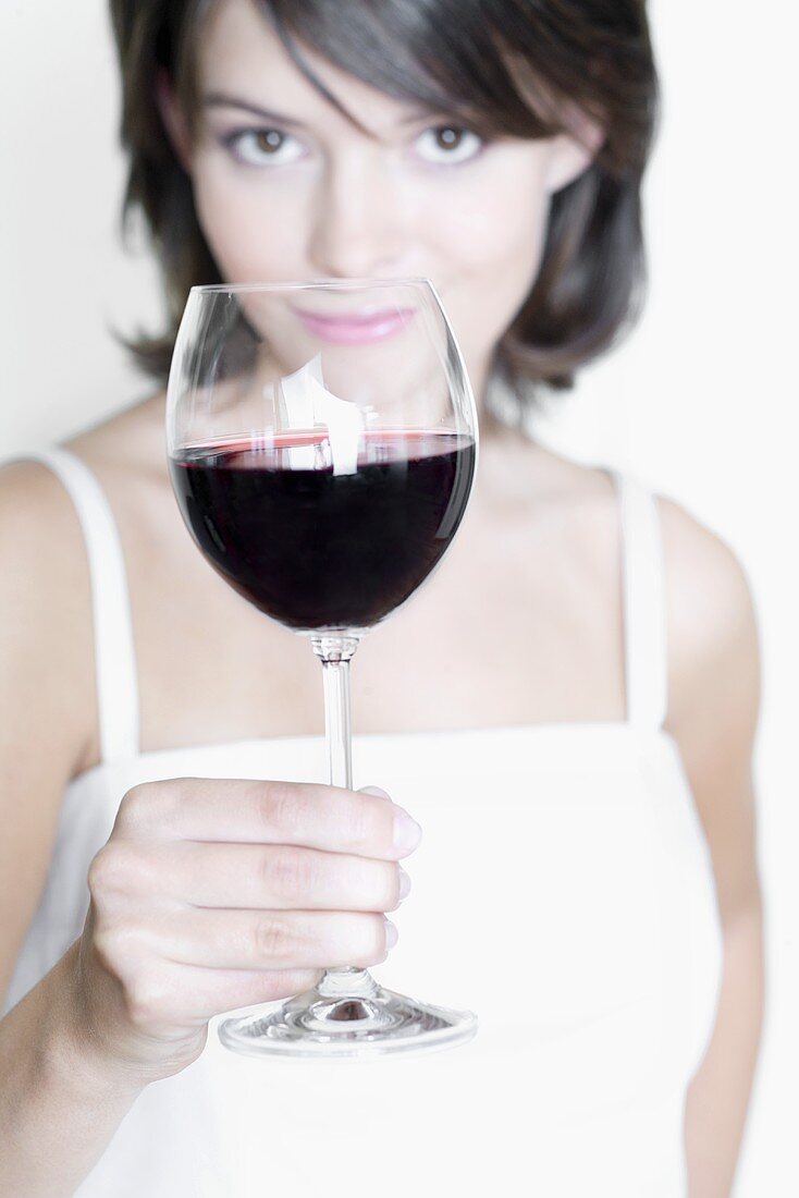 Young woman with a glass of red wine