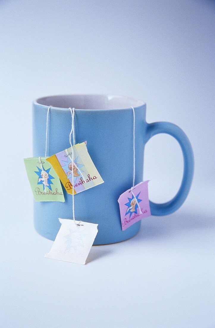 Several tea bags in a mug