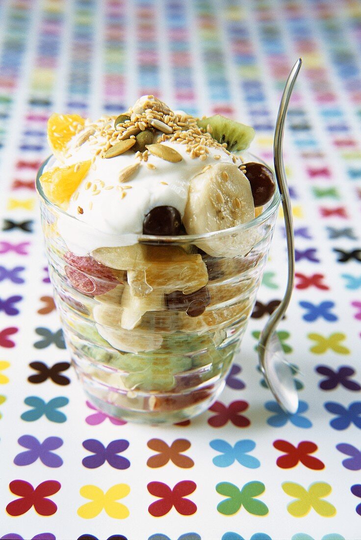 Fruit salad with yoghurt and seeds