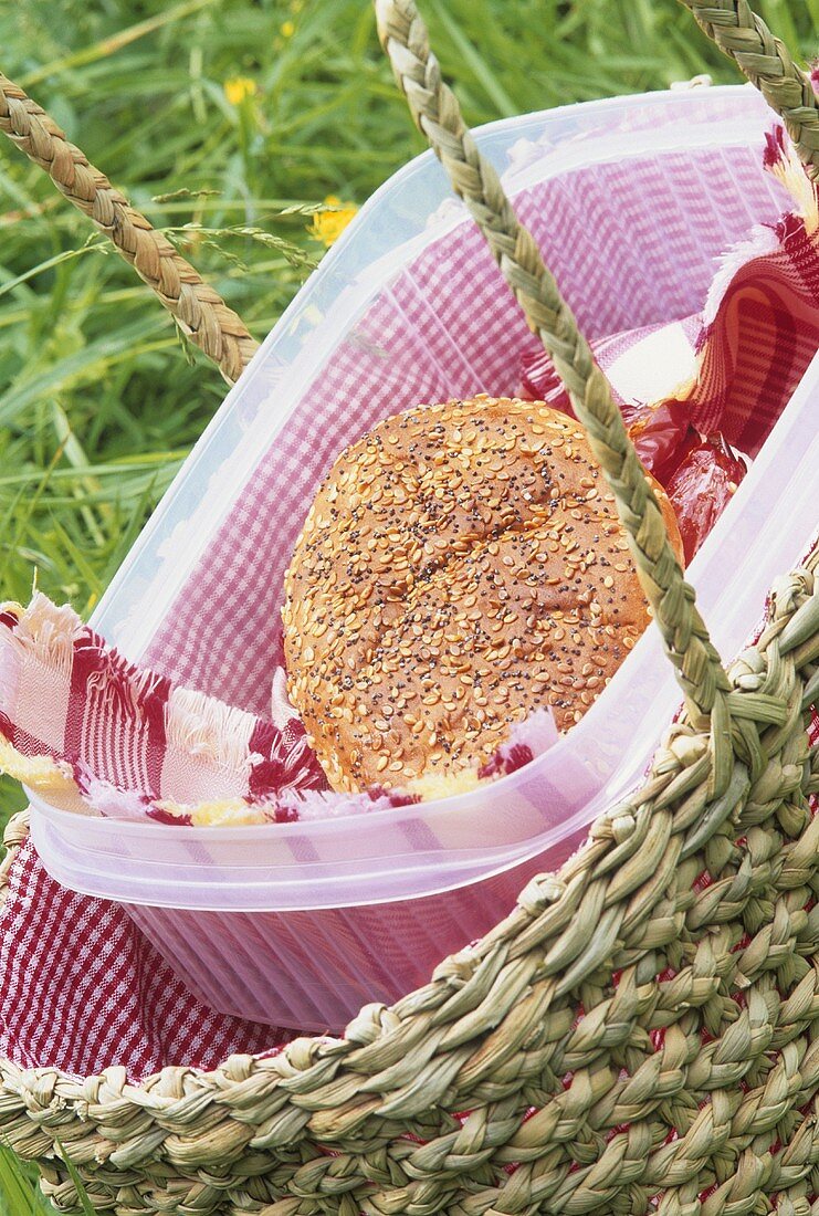 A bread roll in a picnic basket