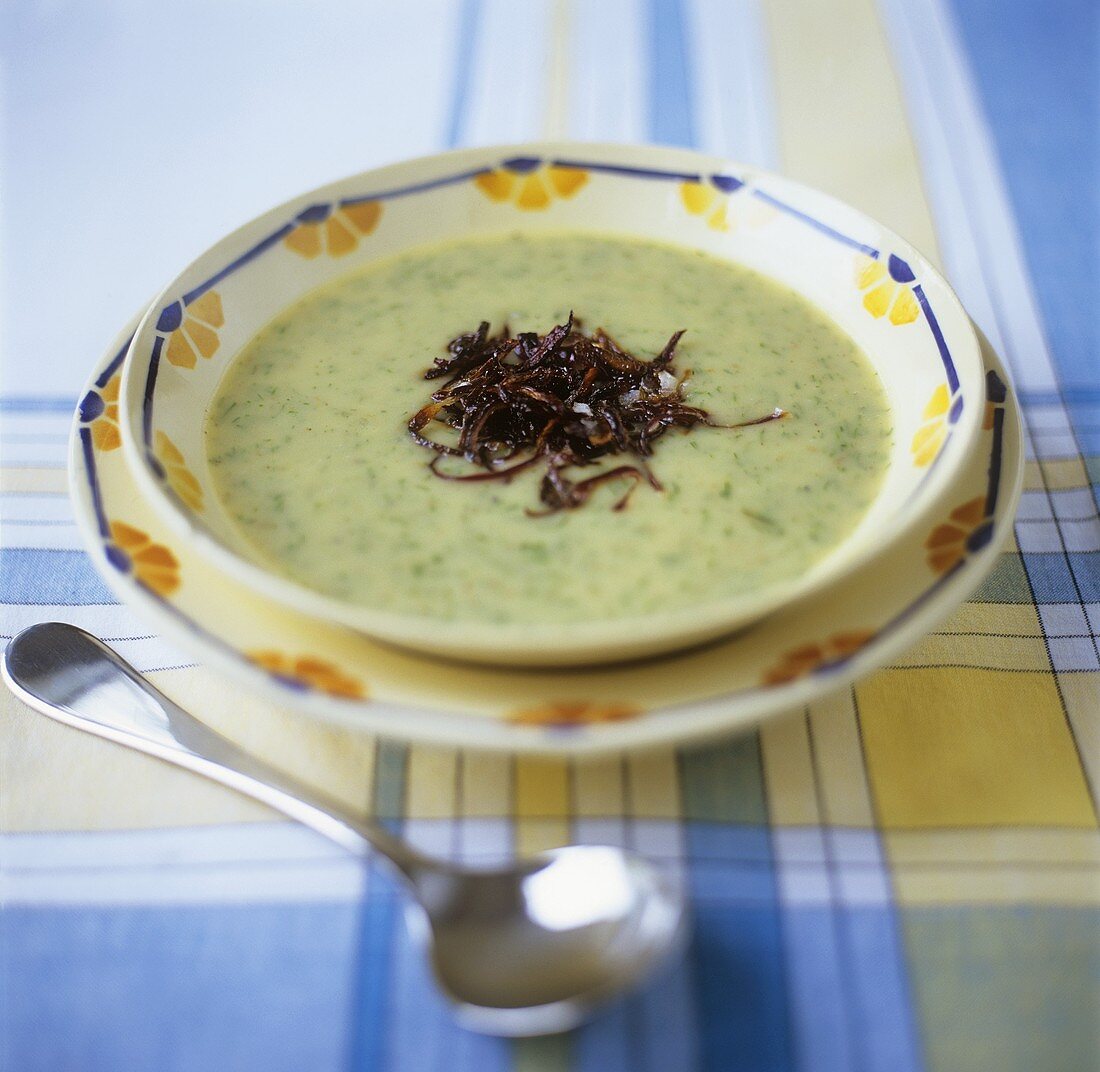 Potato and herb soup with fried onions