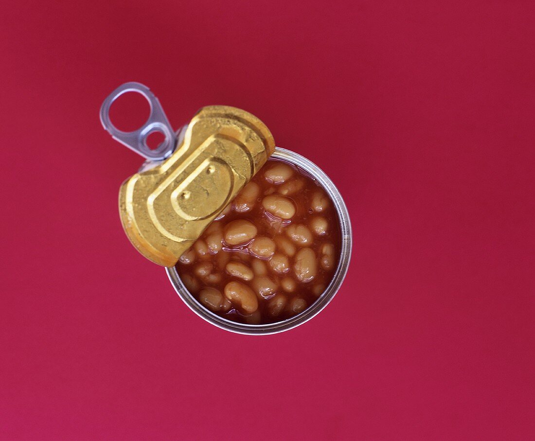 An opened tin of baked beans