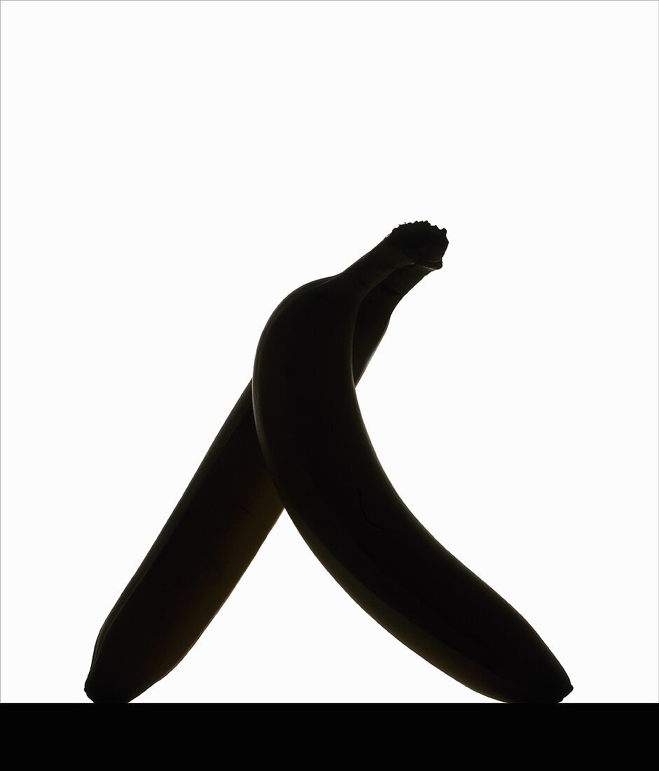 Two bananas against a white background