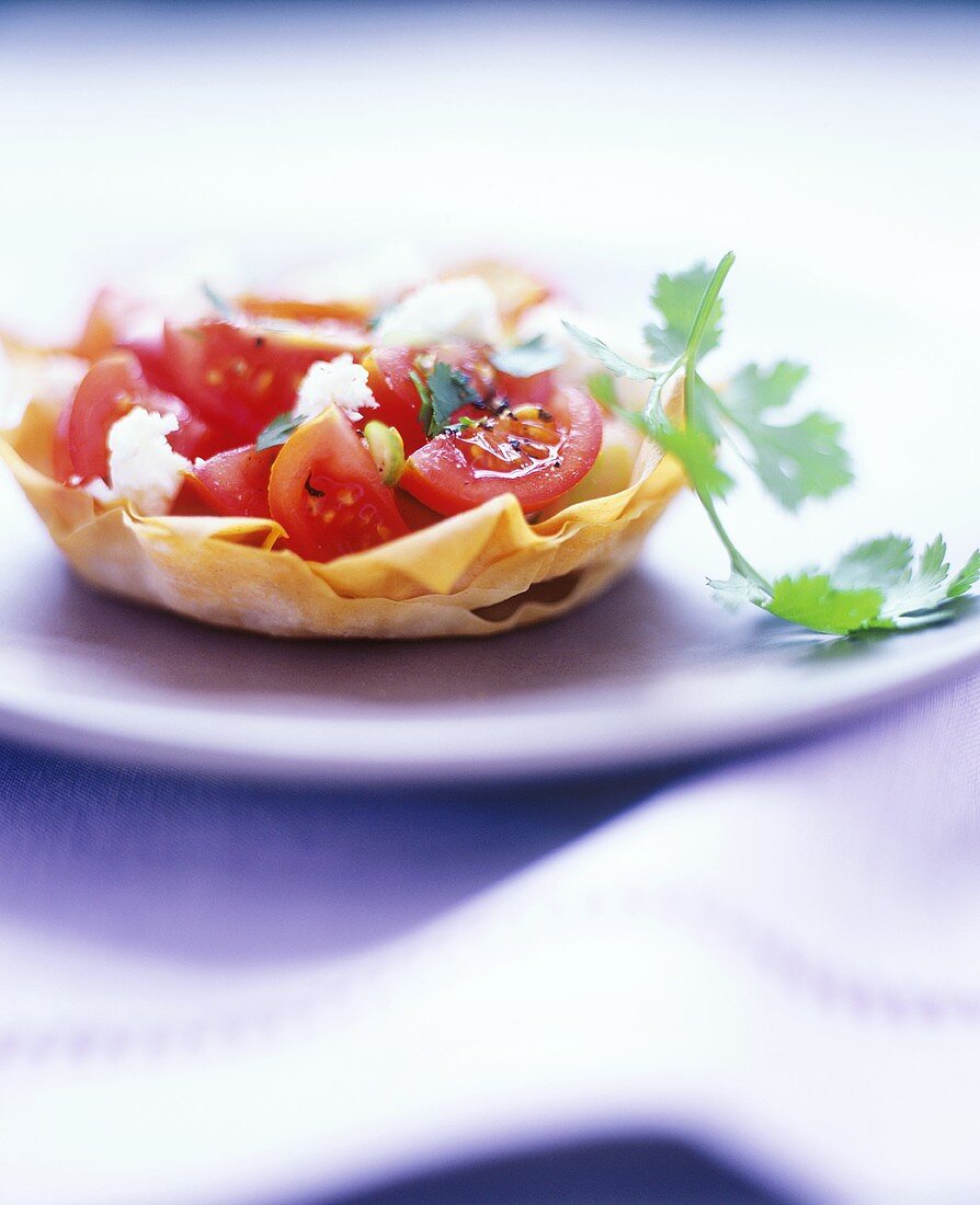 Tomato salad with feta and coriander in pastry shell