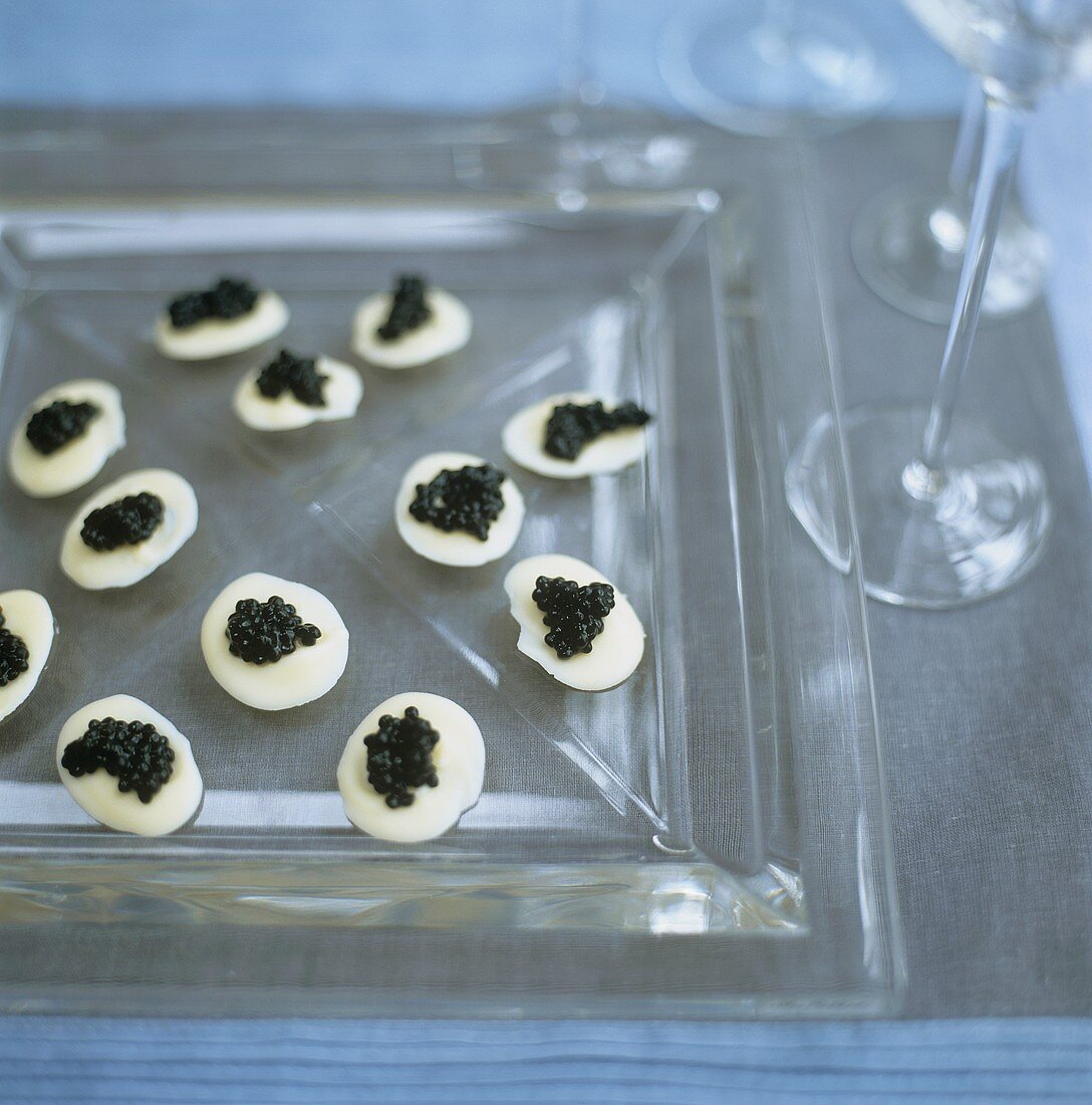 Avruga caviar on white chocolate rounds
