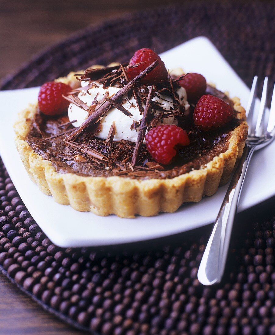 Chocolate tart with raspberries and cream