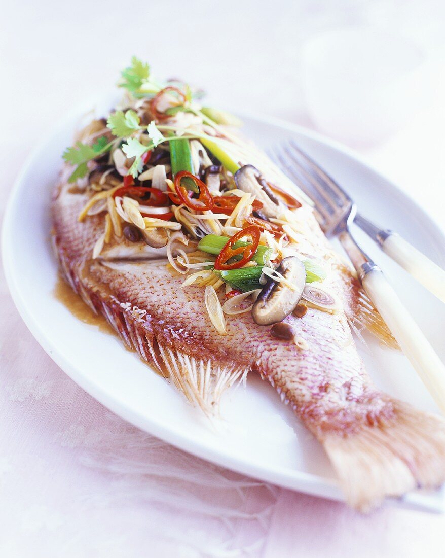 Red snapper with ginger, spring onions, chilli & mushrooms