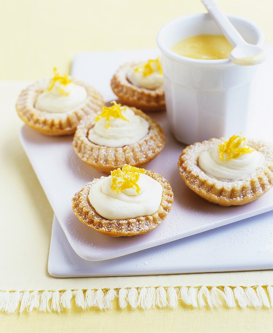 Lemon cream tarts with lemon zest