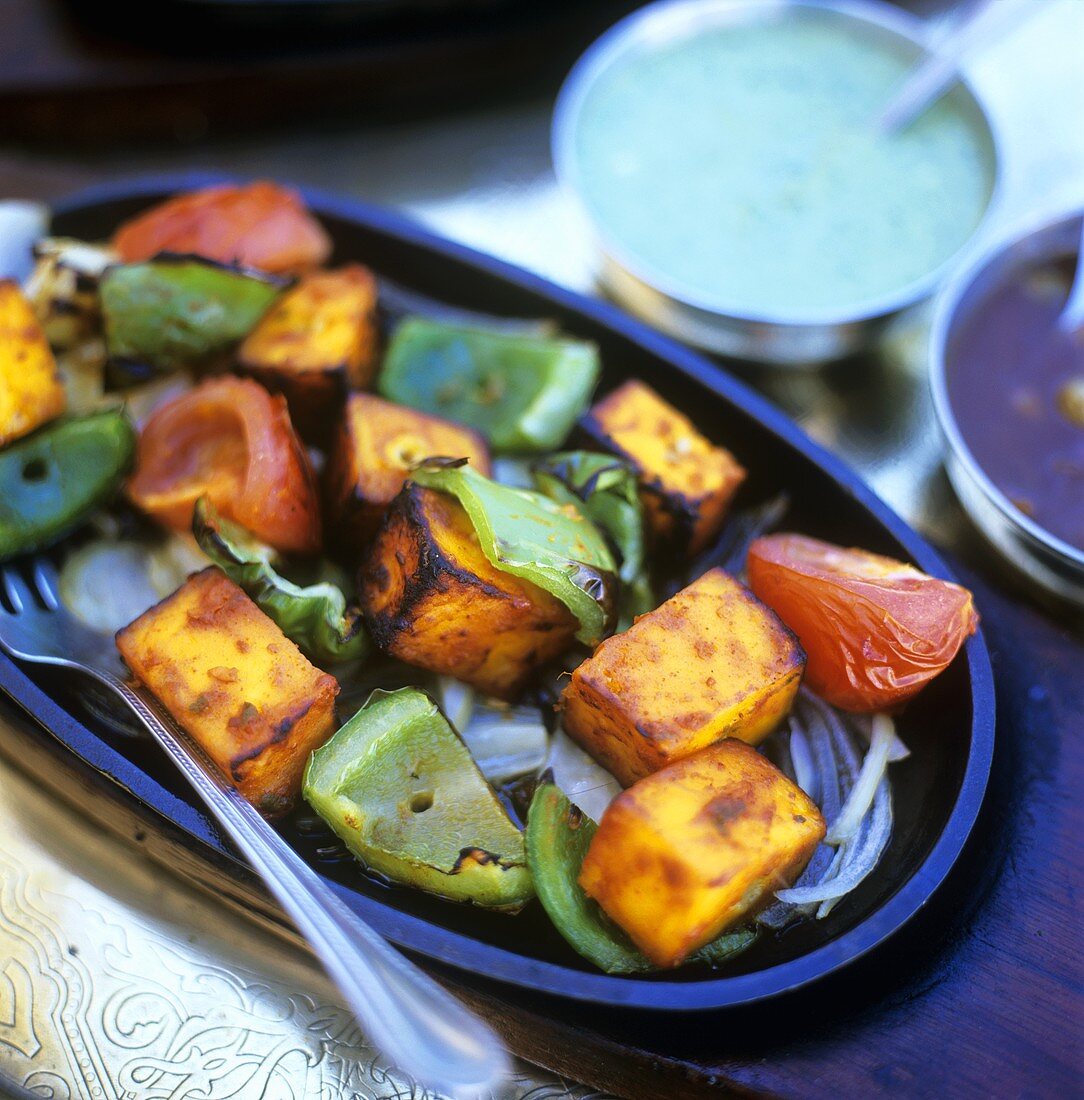 Roasted sweet potatoes, peppers and tomatoes