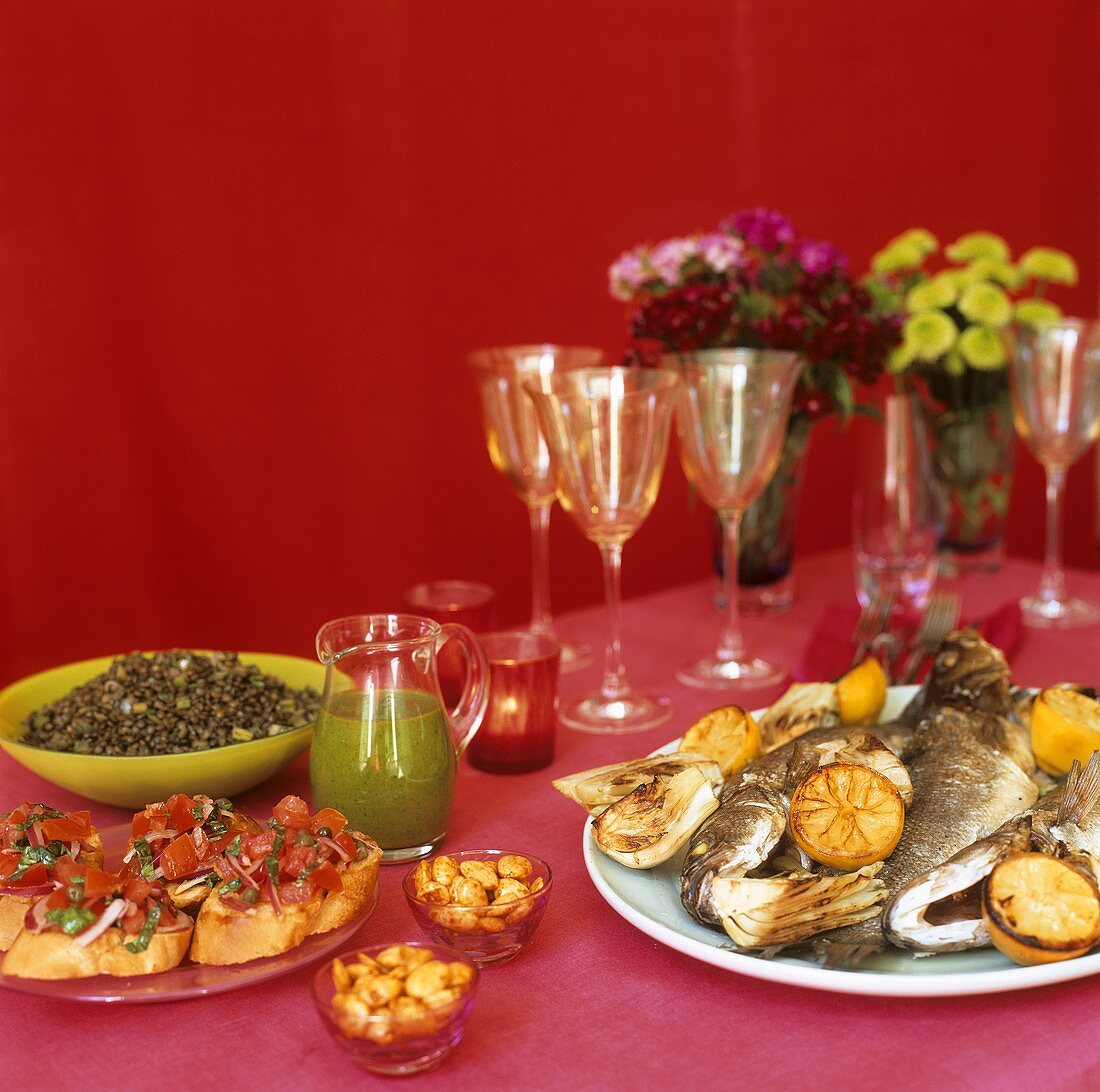 Buffet with bruschetta, fried sea bass & mountain lentils
