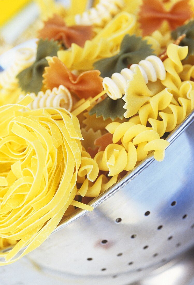Various types of pasta in colander