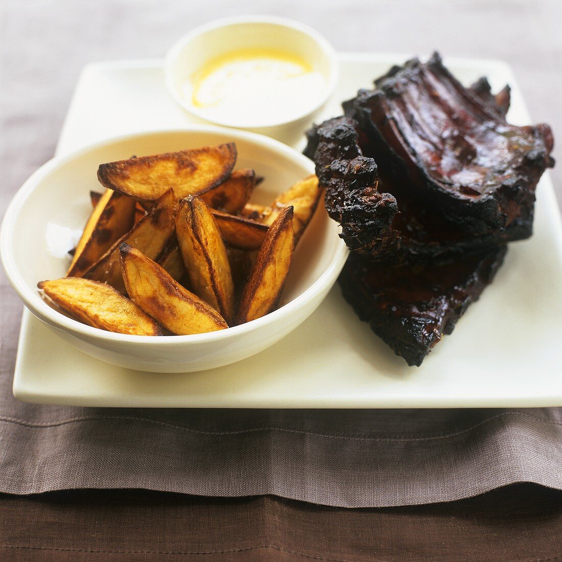 Spare ribs with honey and soya marinade and potato wedges