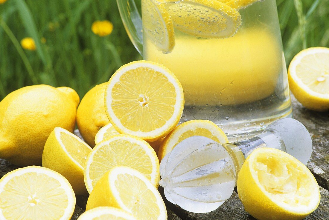 Carafe of lemonade and fresh lemons