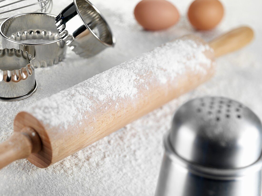 Still life with rolling pin, flour, cutters, eggs