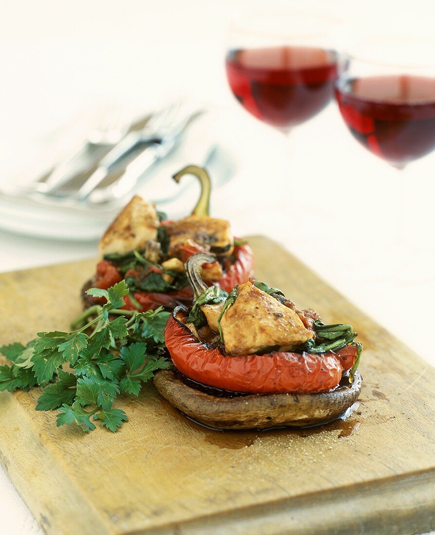 Chicken breast with red peppers and large mushrooms