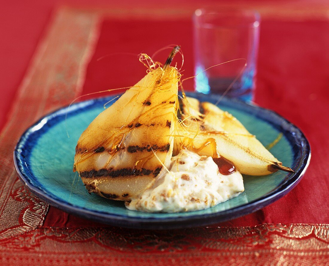 Grilled pears with spun sugar and cream with sponge crumbs