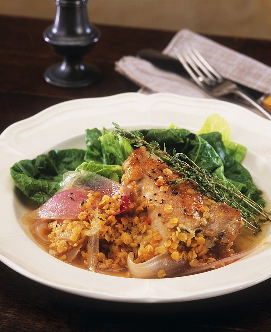 Braised chicken with red onions, lentils, cabbage leaves