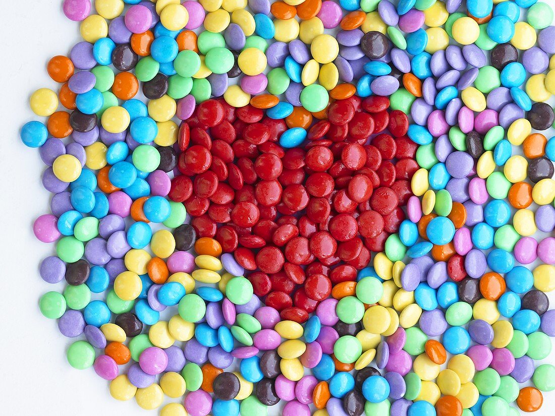 Coloured chocolate beans with red heart