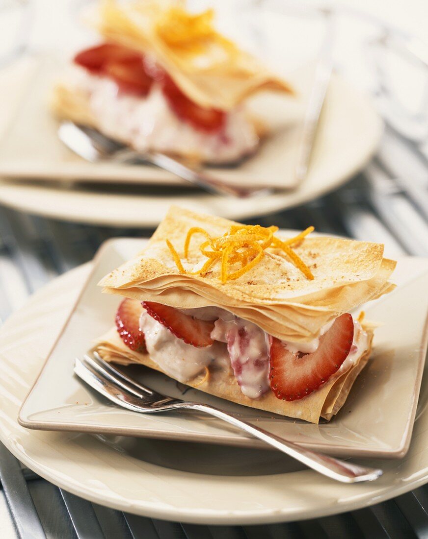Crisp pastry leaves filled with strawberries and yoghurt