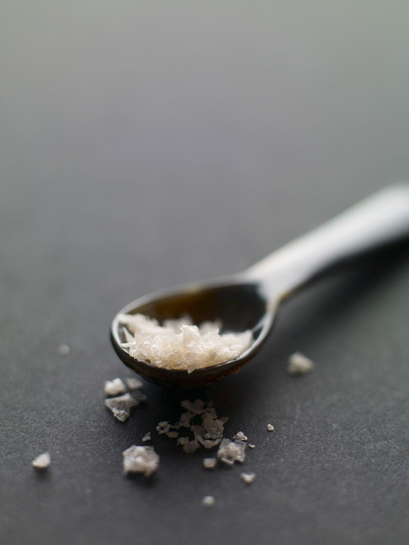 Pink sea salt on a spoon